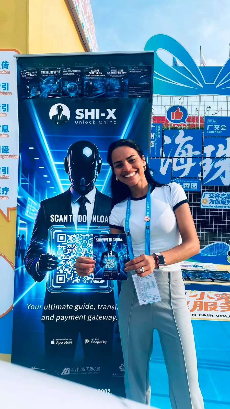 A Canton Fair visitor holding a Shipay trade guide